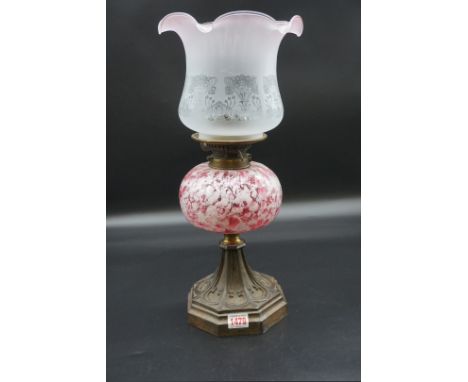 A Victorian steel and marbled glass oil lamp, height including shade 47cm.&nbsp; 