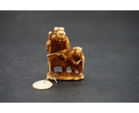 A good Japanese carved ivory netsuke, possibly by Yoshi, Meiji, depicting two figures with baskets on their backs, signed, 4c