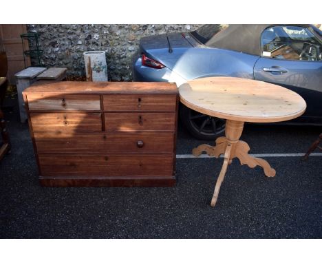 A pine breakfast table, on a tripod base 91cm wide x 75cm high; together with a mahogany chest of four short and two long dra