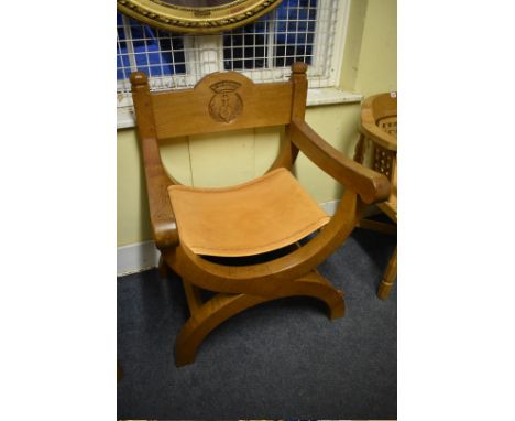 A Robert 'Mouseman' Thompson large oak 'X' frame bishop's chair, 68cm wide.&nbsp; This probably unique chair was commissioned