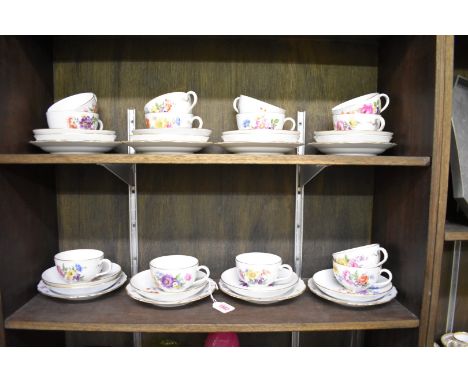 A set of thirteen Meissen teacups and saucers,&nbsp;with eight matching side plates, each painted with flowers and insects, t