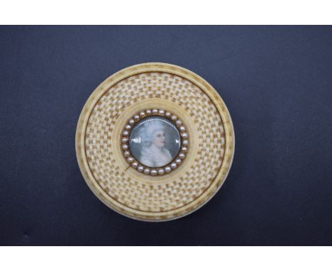 A good late 18th century French ivory circular box and cover,&nbsp;with carved basketweave design, the top inset with a portr