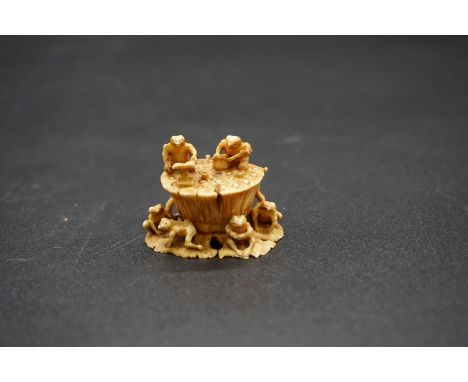 A carved Japanese ivory netsuke, by Gyokuzan, Edo, depicting toads on a lily pad, signed, 3.6cm wide, (s.d.). 