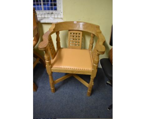 A Robert 'Mouseman' Thompson oak monk's chair,&nbsp;with lattice panels. 