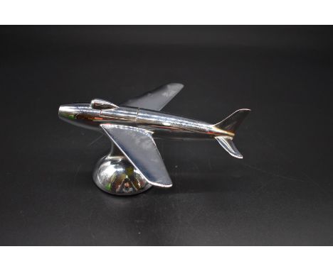 A vintage Dunhill chrome novelty table lighter,&nbsp;in the form of a 1954 F-86 Sabre jet plane, 16.5cm long. 