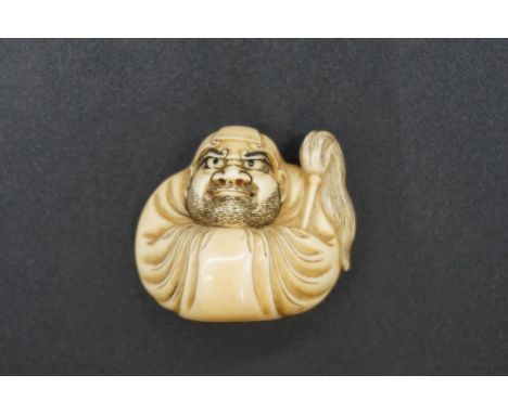 A good Japanese carved ivory netsuke, by Masahiro, Edo, depicting Daruma wall-gazing, with inset eyes, signed, 3.5cm high. 