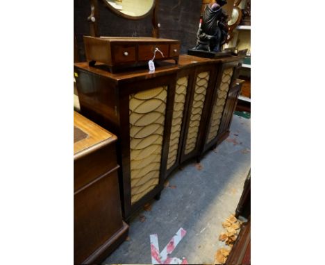 A George IV rosewood inverted break bowfront chiffonier, with brass grill doors, 129.5cm wide.&nbsp; 