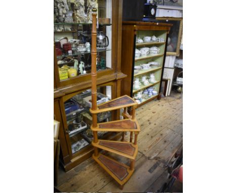 A set of reproduction mahogany spiral library steps, with four leather inset treads and brass finial, 145cm high.&nbsp; 