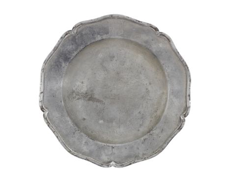 A George III pewter five lobed wavy-edged plate, circa 1800The rim with a single reeded edge, engraved with the crest of HAMI
