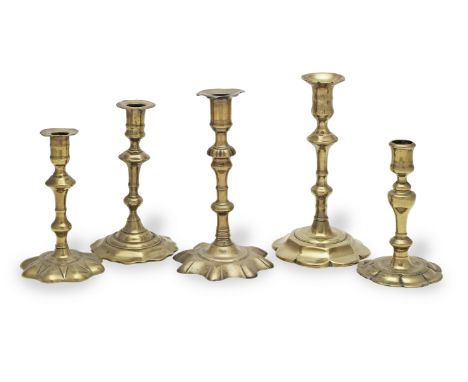 An early to mid-18th century brass alloy socket candlestick, circa 1730With a tulip-shaped candle socket and acorn-knopped se