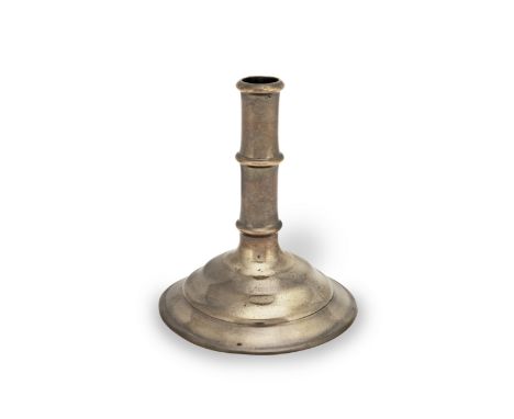 An unusual copper alloy socket candlestick, European, probably 17th centuryThe tubular stem with moulded socket rim and cast 