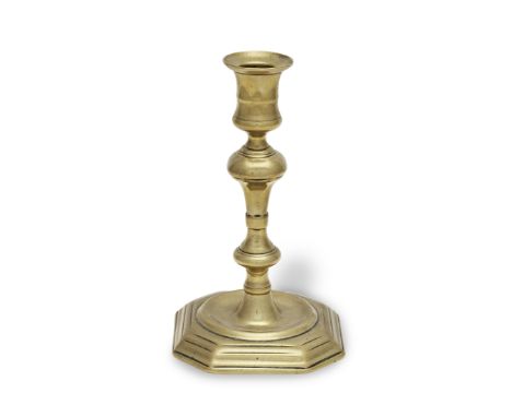 A George I brass socket candlestick, circa 1720With the ownership initials 'BH' engraved to the underside of the baseLarge an