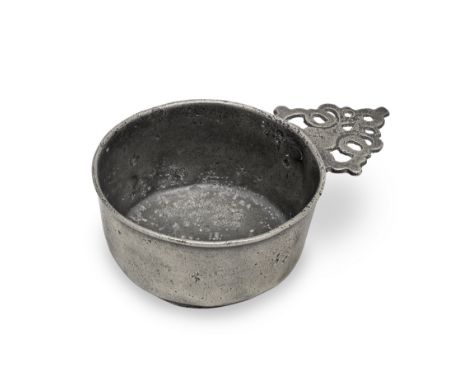 A Charles II pewter OEWS half-pint porringer, Wigan, circa 1680Having a straight-sided bowl, a flat base with shallow footrim