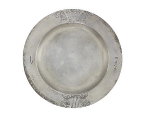 A rare Charles II pewter plain rim armorial plate, circa 1680The rim engraved with crest 'out of a ducal coronet, a panache o