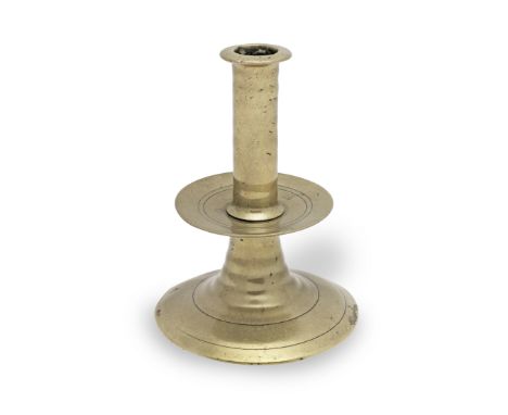 A small mid- to late 17th century brass alloy trumpet-based socket candlestick, English, circa 1650-80With corded upper and l