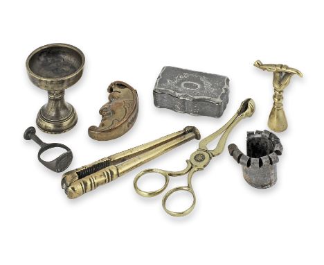 An 18th century brass lever-action nutcracker, EnglishOf typical form, one handle terminating in a nut, the other with a pipe