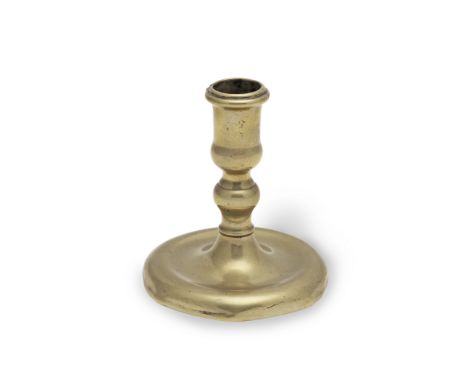 A rare early 18th century brass dwarf socket candlestick, circa 1700-20Possibly from a toilet serviceSeamed, the slightly tul