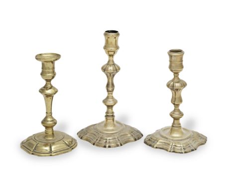 A good George II brass alloy socket candlestick, circa 1740With seamed stem and nozzle, and on a base cast with convex corner