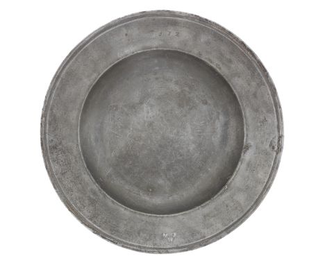 A fine Charles II pewter semi-broad rim dish, circa 1680The rim with incised multiple reeding and bearing ownership triad 'E 