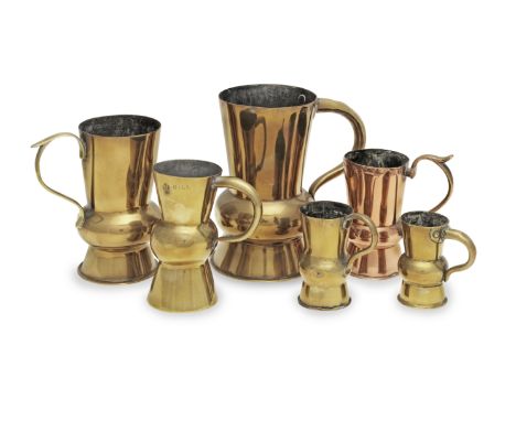Five brass and one copper 19th century thistle-shaped measures, two marked for GlasgowThe first, brass example, 15cm high, th