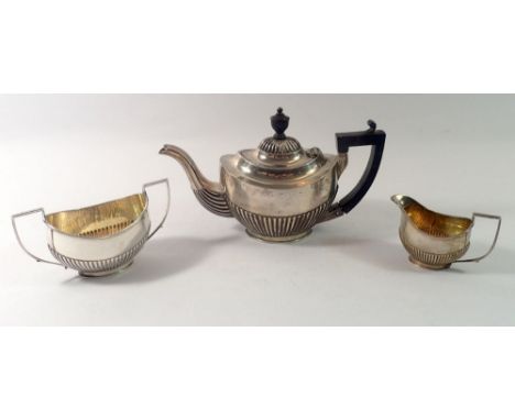 A James Dixon silver half reeded three piece bachelors tea set, Birmingham 1898, 357g 