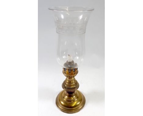 A Victorian brass candle lamp with glass shade, 38cm 