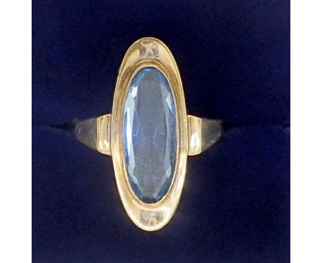 A gold ring set long oval cut blue topaz, unmarked but tested as gold, 3g, size N 