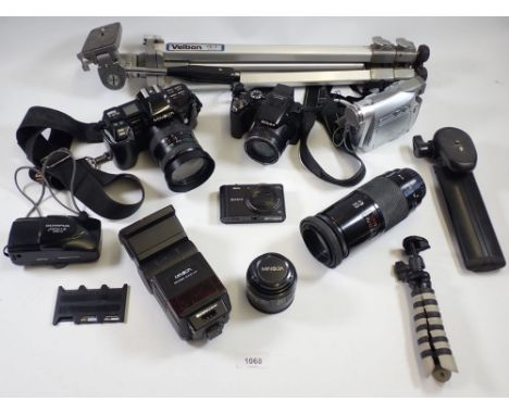 A box of cameras and camera accessories including Nikon, Minolta, camera stand etc. 