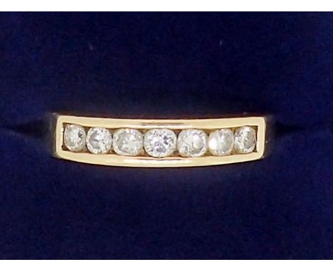 A 9 carat gold seven stone diamond ring, 2.5g, size M 