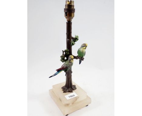 A 19th century cold painted spelter table lamp in the form of budgerigars on a tree trunk, on alabaster base, 34cm 