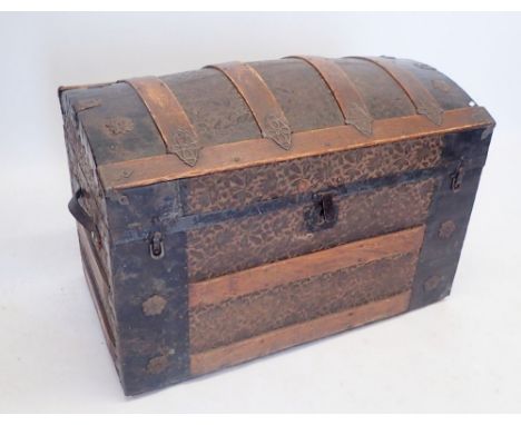 A Victorian floral embossed leather covered wood and metal bound dome top trunk, 81 x 45 x 53cm 