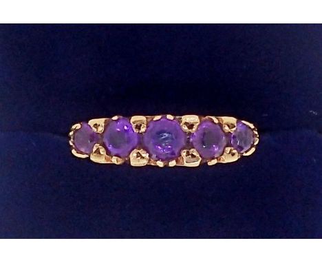 An antique style 9 carat gold ring set five graduated amethysts, 2.6g, size P 