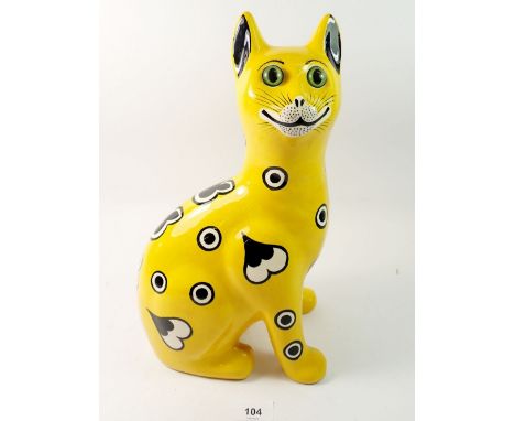 A Griselda Hill Wemyss cat decorated hearts and spots on a yellow ground, 33.5cm 