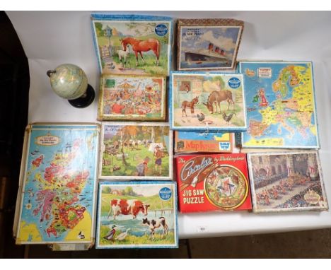 A box of vintage wooden jigsaw puzzles including Victory Boy Scout's Camp, maps, horses etc. plus Chad Valley small globe 