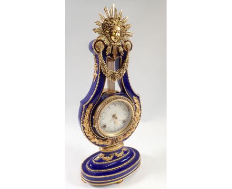 A V&amp;A Marie Antoinette porcelain lyre form mantel clock, 40cm 