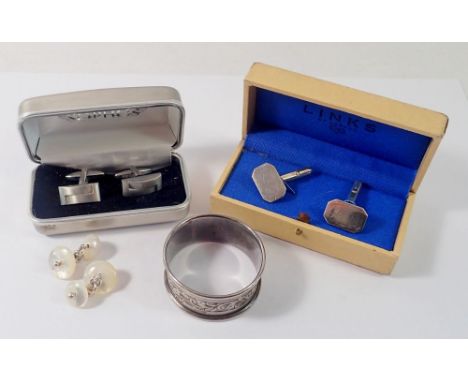 A pair of silver Links of London cufflinks, a silver napkin ring and two other pairs of cufflinks 