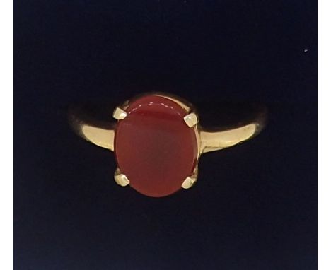 A gold ring set orange stone unmarked but tested as 15ct gold, 2.5g, size N to O 