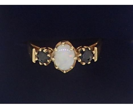 A 9 carat gold opal and sapphire ring, size M, 1.7g 