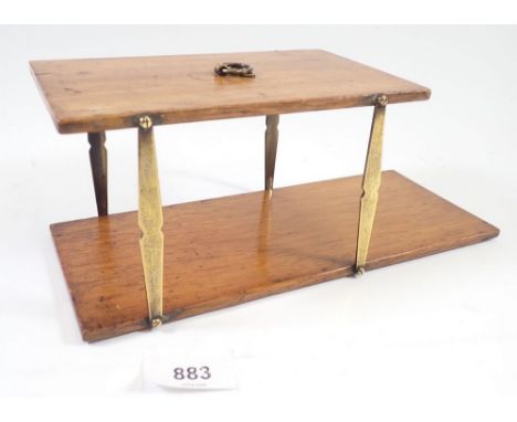 A folding campaign brass and mahogany hanging shelf, 10 x 27cm 