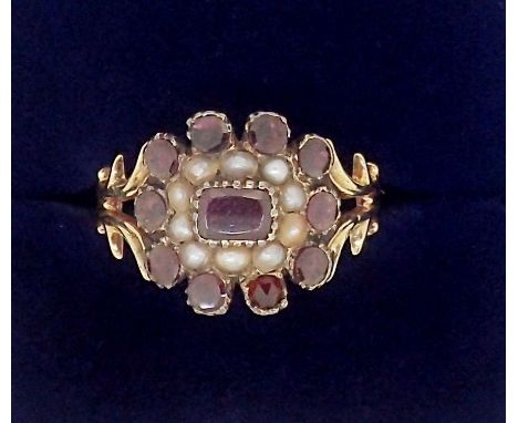 A Victorian 9 carat gold garnet and seed pearl ring, size J, 2.9g, boxed 