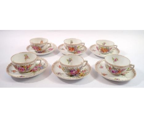 A set of six Dresden floral painted tea cups and saucers 