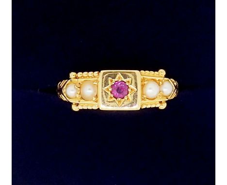 An Edwardian 18 carat gold ring set ruby flanked by four seed pearls, 2.5g, size M - boxed 