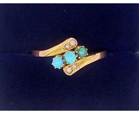 A 9 carat gold ring crossover set three turquoise and seed pearls, 1.2g, size N 