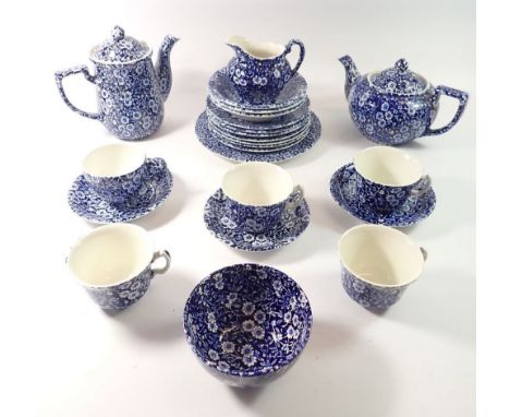 A Burleigh 'Calico' blue and white tea service comprising teapot, coffee pot, five cups, three saucers, three bowls, seven te