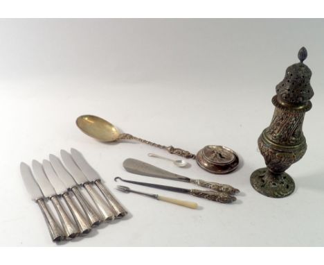 A group of silver handled tea knives, shoe horn and button hook plus white metal sugar caster and serving spoon 