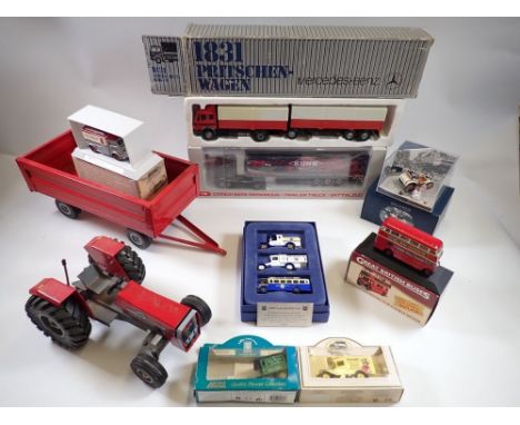 A Massey Ferguson deur FedMech tractor, 26cm long and trailer, two German model lorries and various small model vehicles 