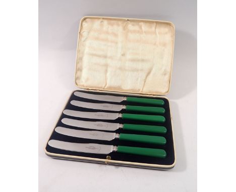 A vintage set of six green handled tea knives, cased 