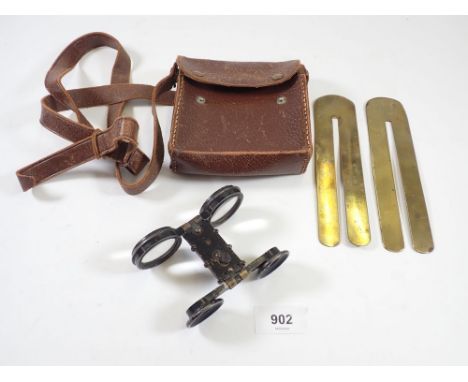 Two military button polishing bars and a pair of folding opera glasses 