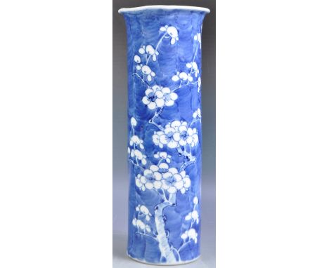 An antique 19th Century Chinese Kangxi mark porcelain sleeve vase of tall cylindrical form hand painted in the Prunus pattern