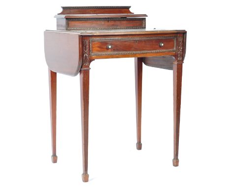 A 19th Century Victorian James Shoolbred &amp; Co mahogany ladies&nbsp;bonheur du jour desk of great small proportions. The d